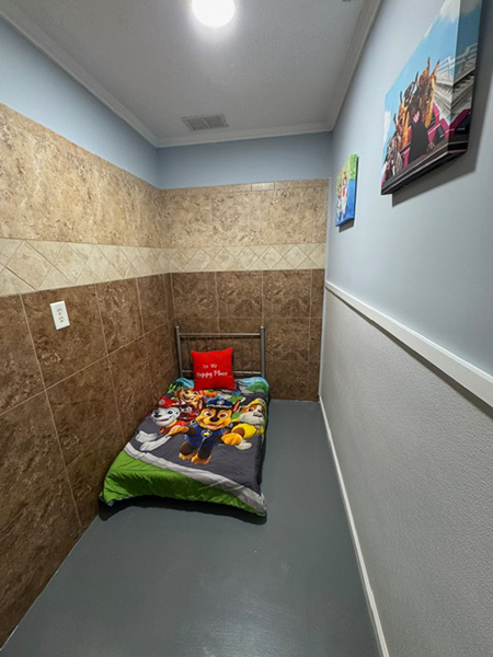 Comfortable dog boarding room at PawPlex